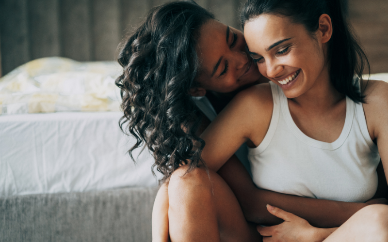 Image of two women in a loving intimate embrace