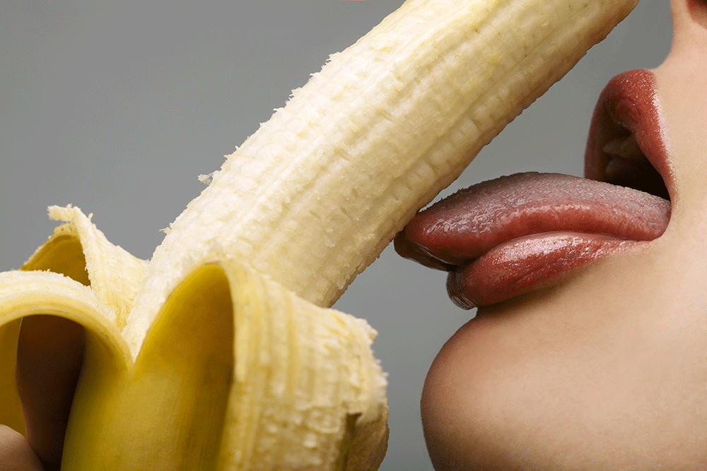 Image of tongue licking banana