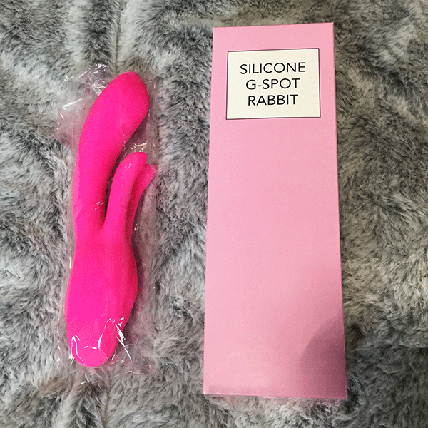 Hot Pink Vibrator Shown Next To Original Boxed Packaging