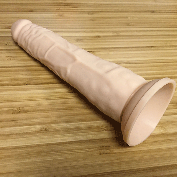 pink bob suction cup dildo on desk