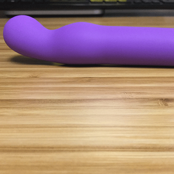 Curved G-spot tip of pink bob purple rechargeable vibe