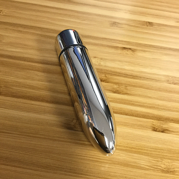 silver bullet clit stimulator on desk