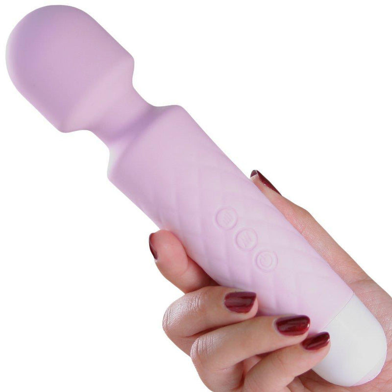 Image of a hand holding a pink wand vibrator