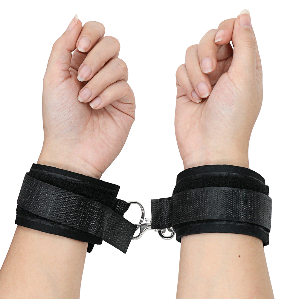 Image of basic black handcuffs shown on hands