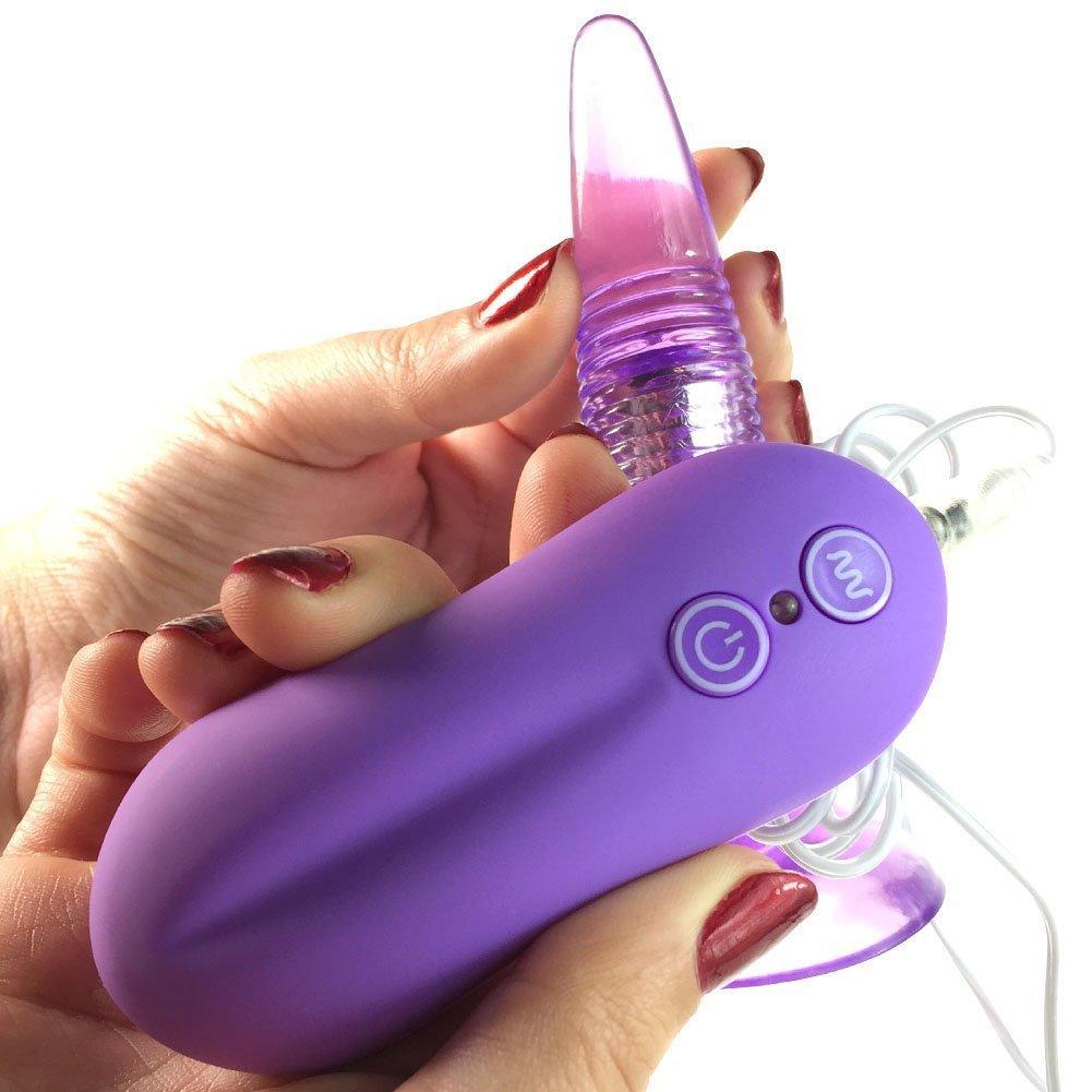 Hands holding purple vibrating anal plug with remote control connected