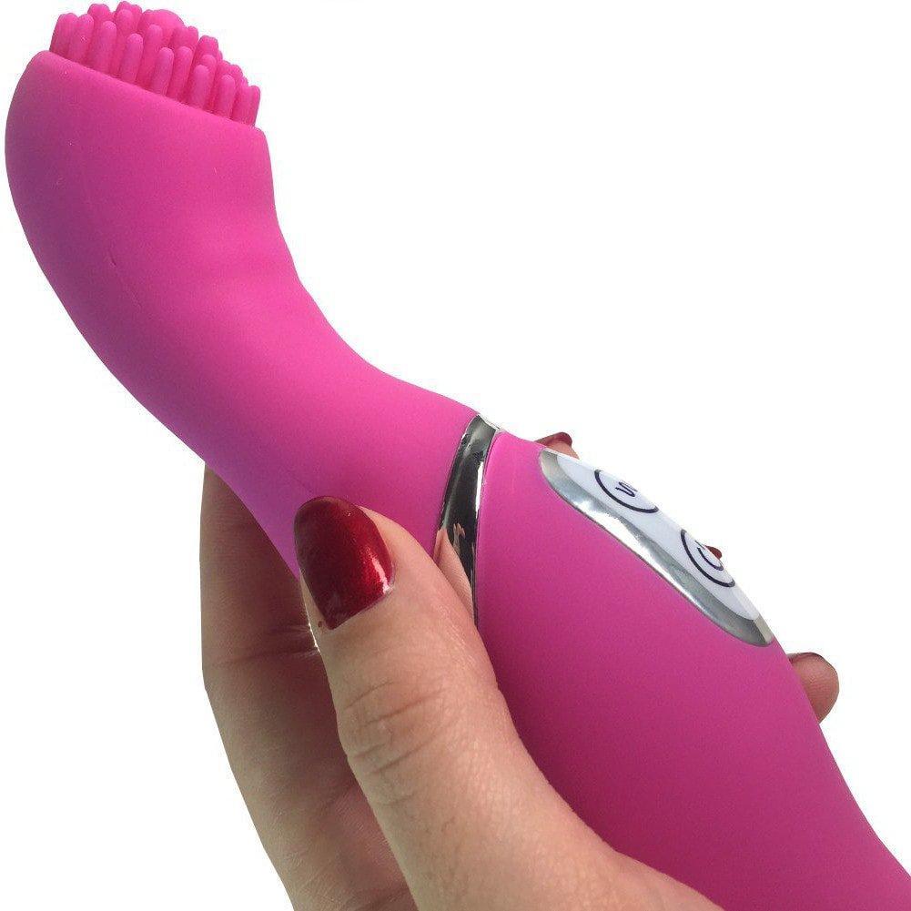 Image of a hand holding a pink nubby vibrator