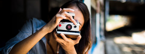 girl with a camera while travelling