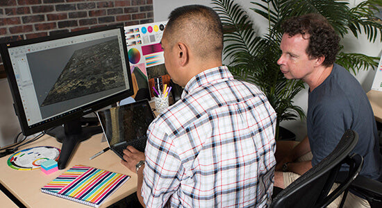 Art Engineers reviewing 3D scan data of a painting