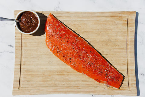 sockeye salmon, bbq sauce next to salmon fillet