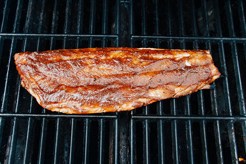 BBQ Sockeye salmon, salmon on a grill with bbq sauce