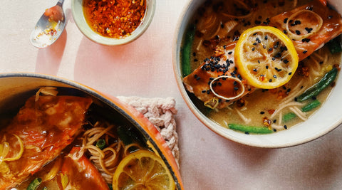This earthy Salmon Soba Noodle Soup recipe combines perfectly cooked salmon portions with soba noodles and vivid yellow roasted lemons in one pot.