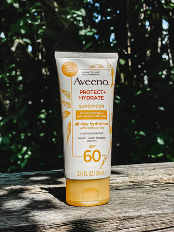Bottle of Aveeno Protect and Hydrate sunscreen.