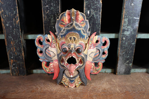 bali carved wood mask with bright colors