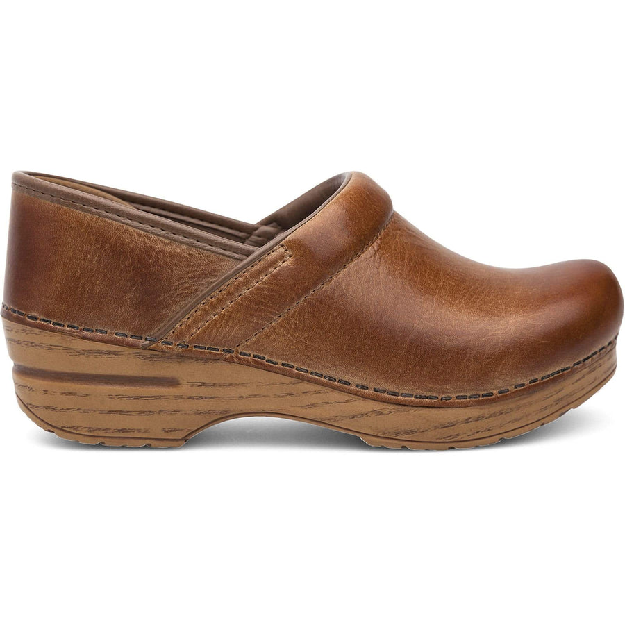 dansko distressed leather clogs