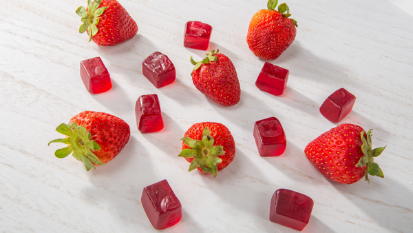 BOLT energy chews surrounded by strawberries