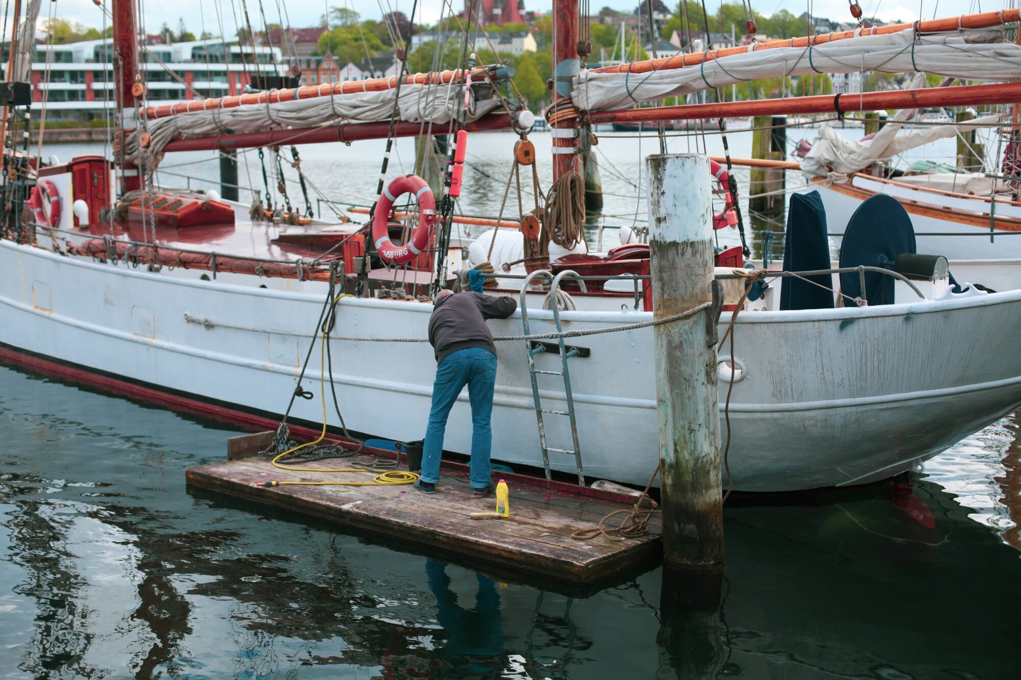 a man tying up a boat