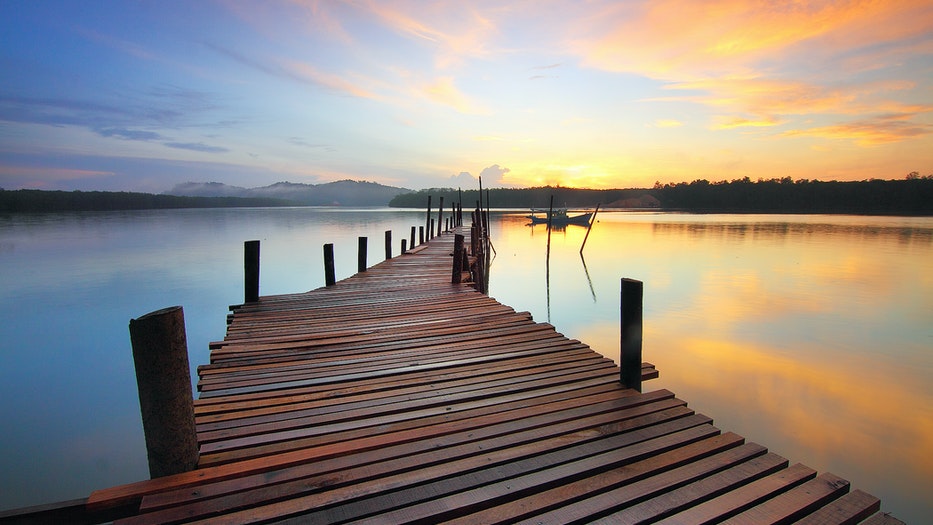 Pros and Cons of 5 Different Types of Lake Docks piling sunset