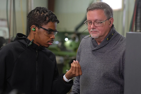 Two men wearing hearing protection