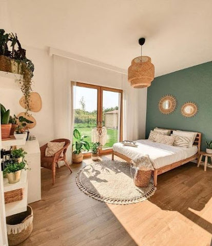 master bedroom with green wall and pendant light