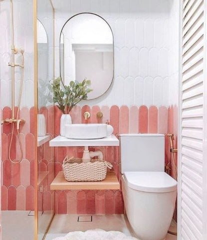 pink bathroom with mirror for added light