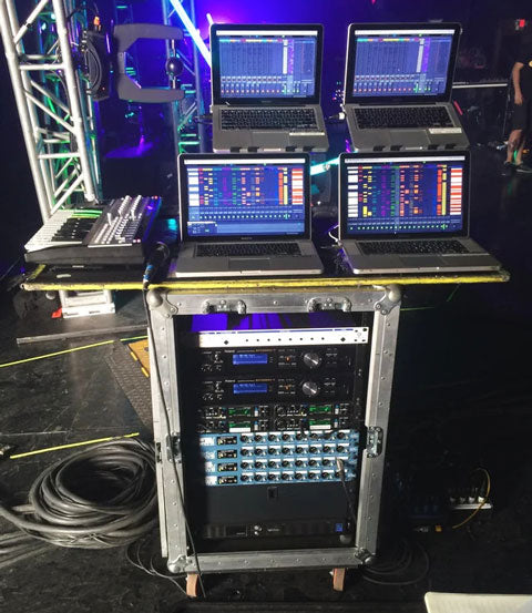 mixer and DJ laptops on stage at a live performance