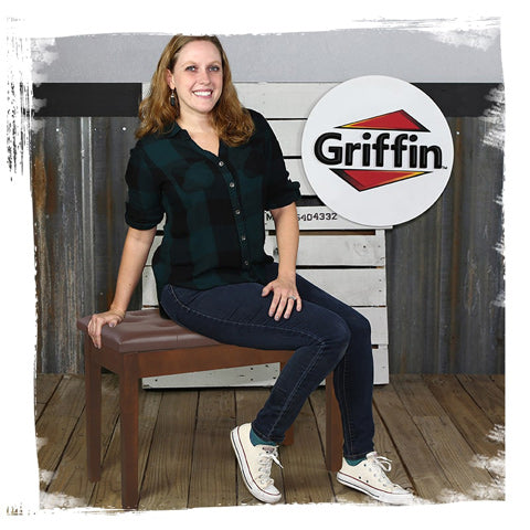 lady sitting on brown wood PU leather piano bench