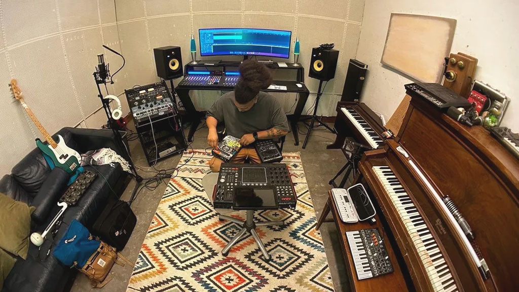 man recording music in his home studio