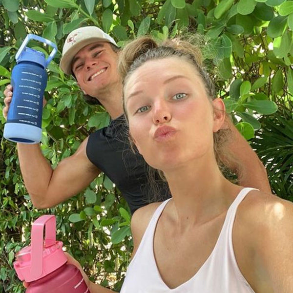 Couple with motivational water bottle