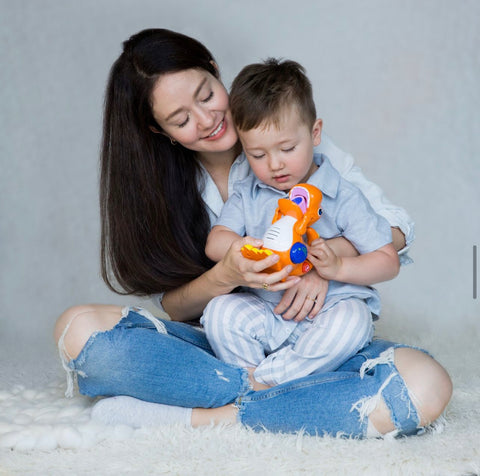 Happy family engaged in interactive play with Kiddolab toys, showcasing bonding and educational fun.