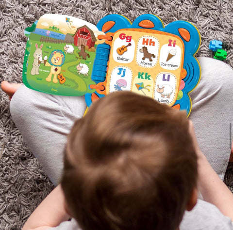 Infant exploring a sensory plush toy, highlighting the importance of tactile stimulation in early development.