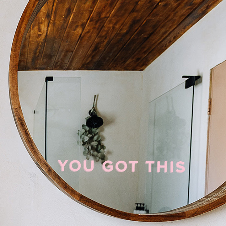 You got this mirror decal, in pink sans serif