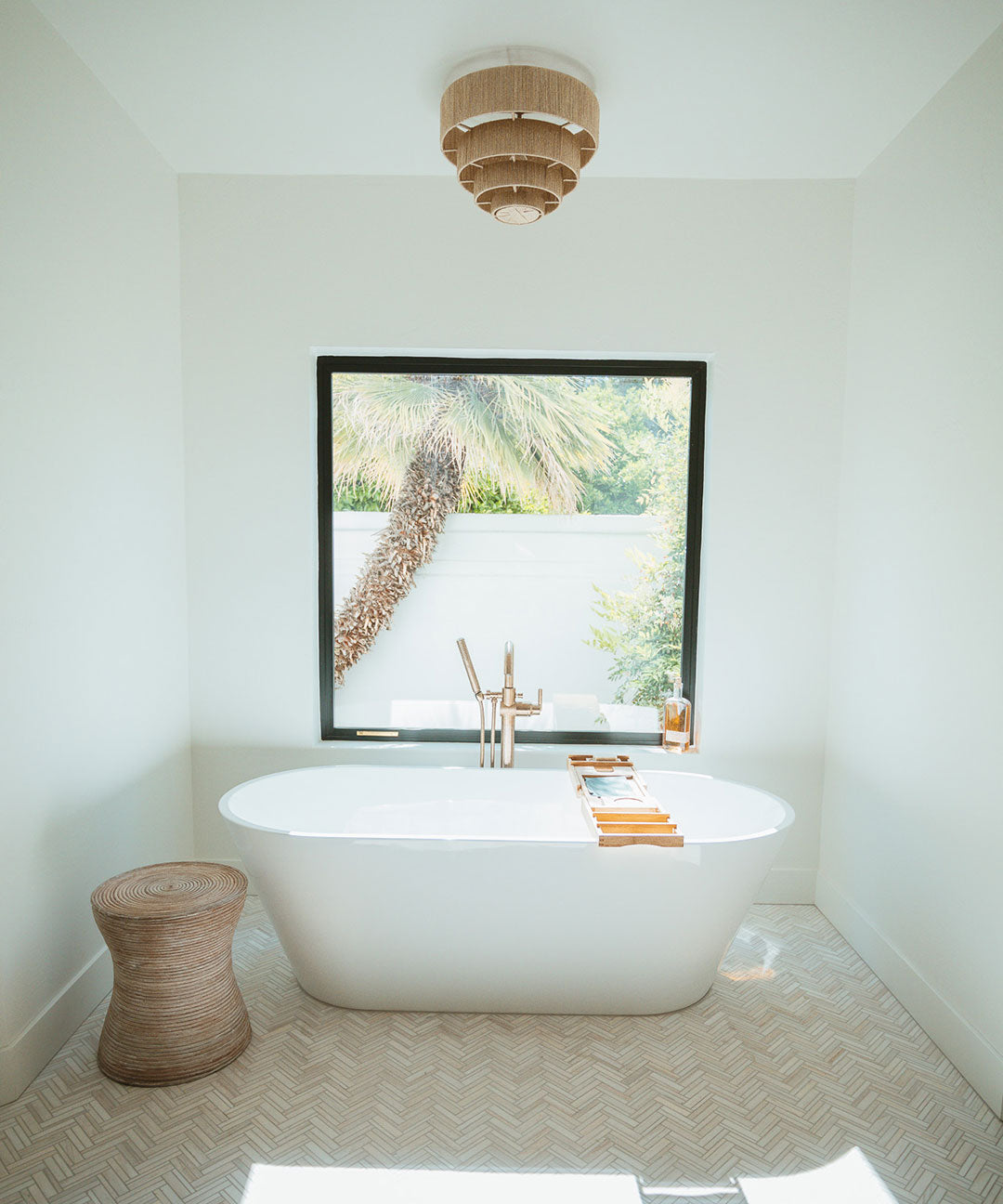 Bathroom with white walls, natural light coming in.