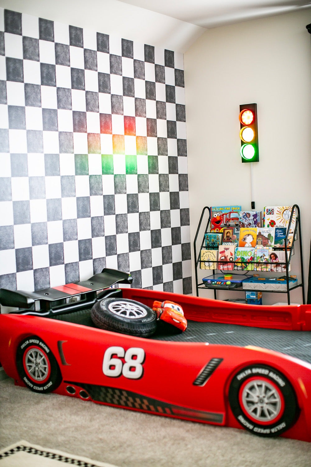 race car themed boys room with black and white checkered wallpaper