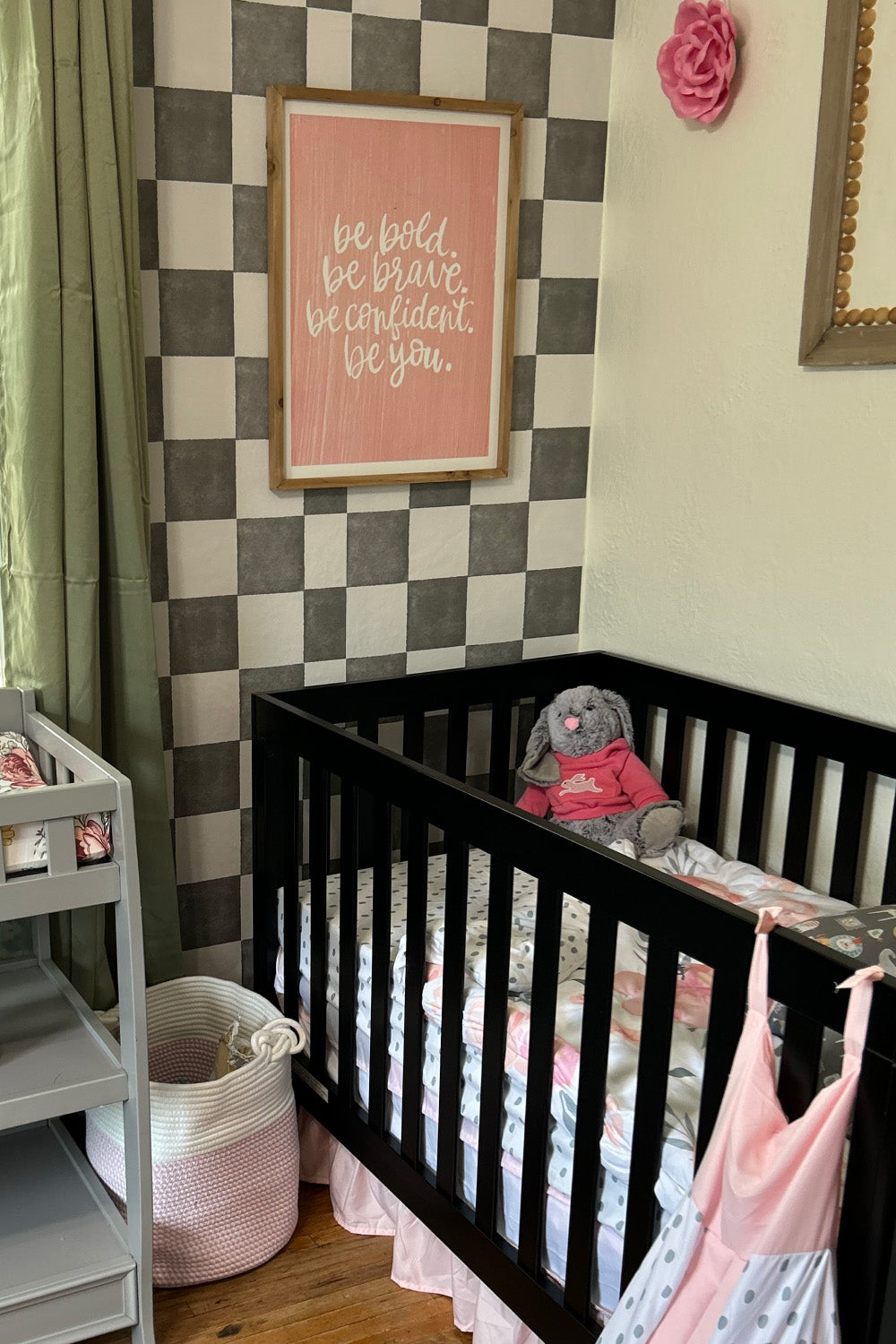 nursery with black and white checkered wallpaper
