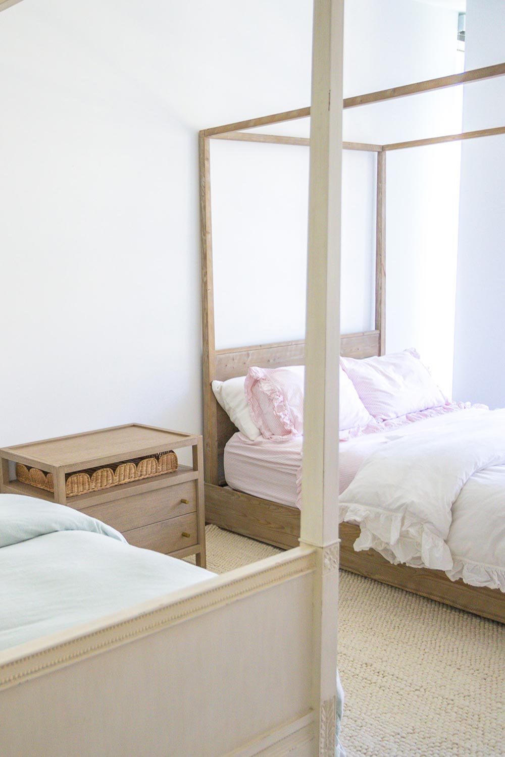 Girls sharded bedroom showing two beds in an apartment.