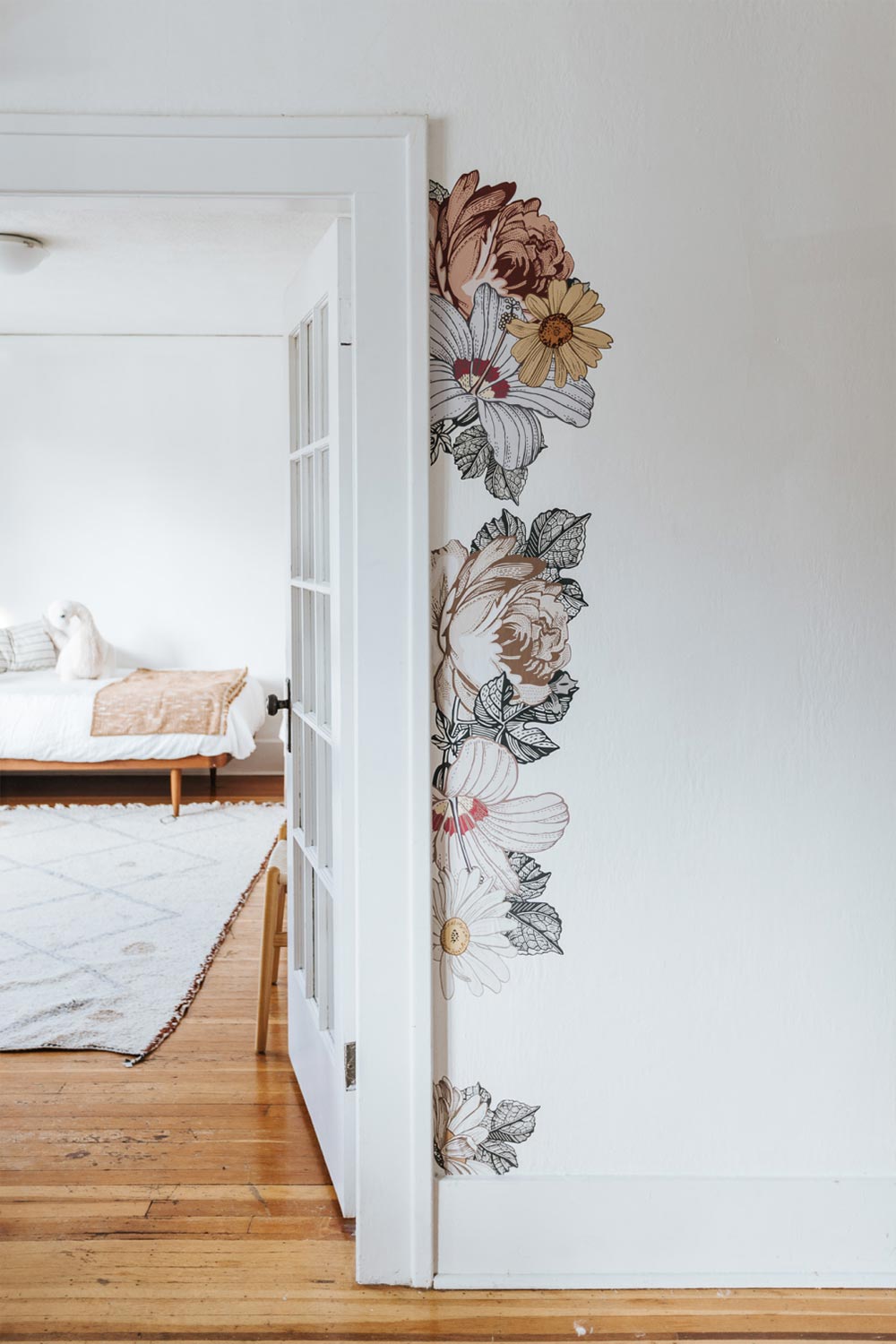 Prairie Floral Wall Decals shown on the right frame of a door leading into a kids bedroom.