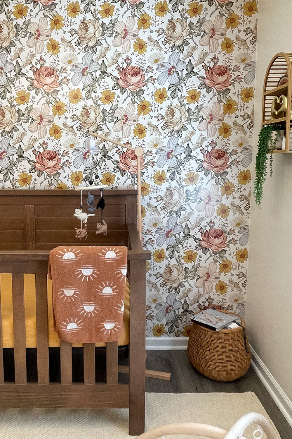 girls nursery with prairie floral wallpaper