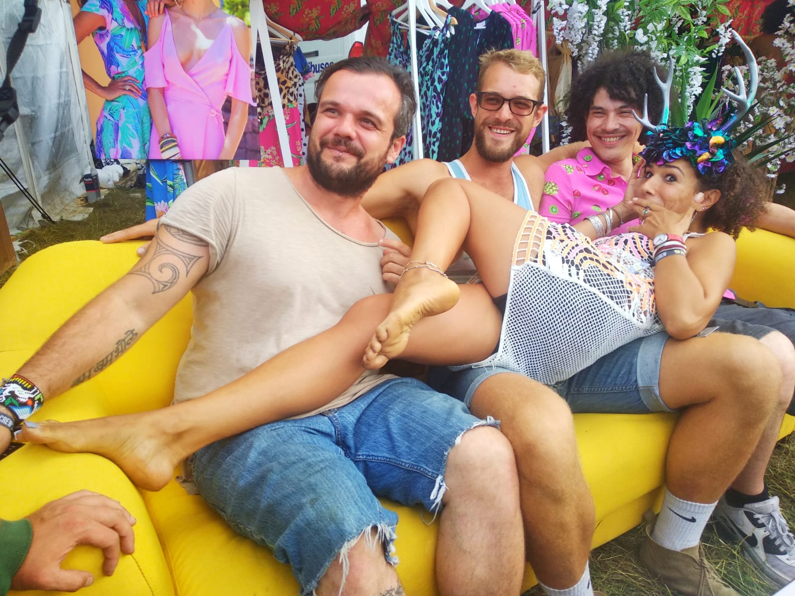 people sat on yellow sofa at Wilderness Festival