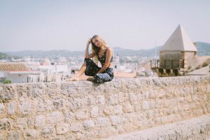 Jessica-Anne sat on walls of Dalt Vila