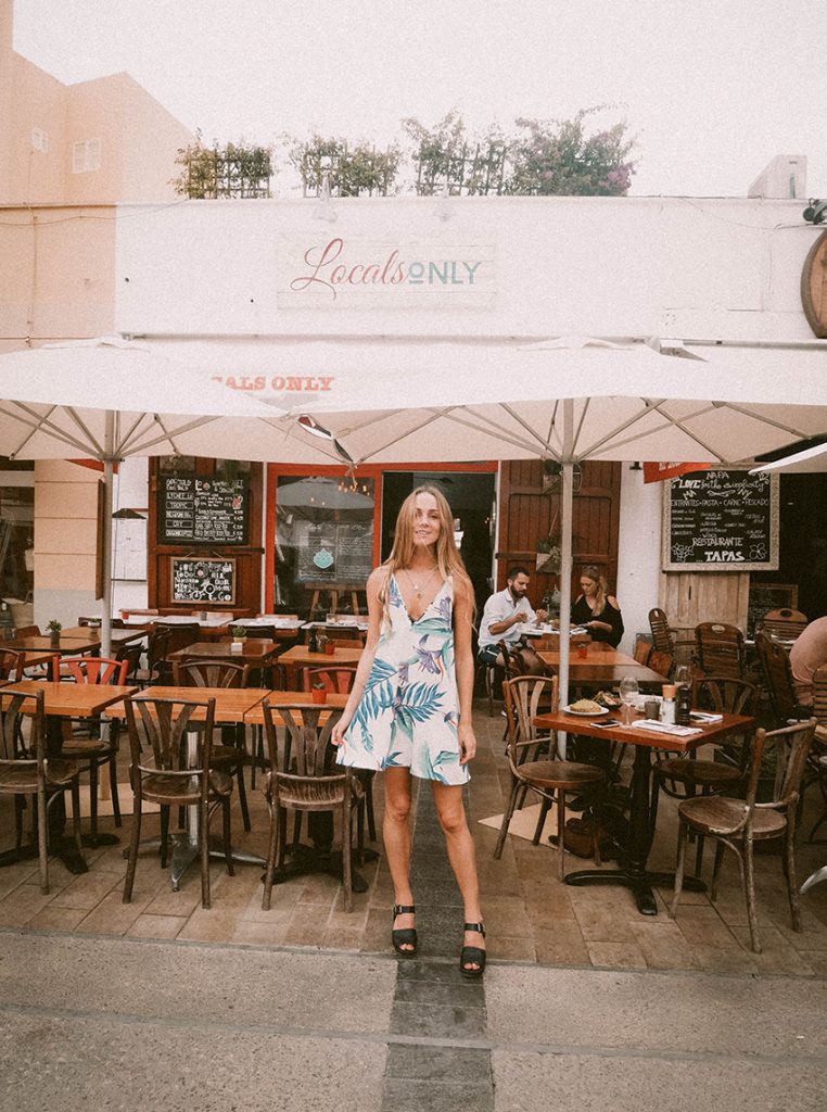 Jessica-Anne wearing Dancing Leopard Samba Dress in White Tropical outside Ibiza cafe