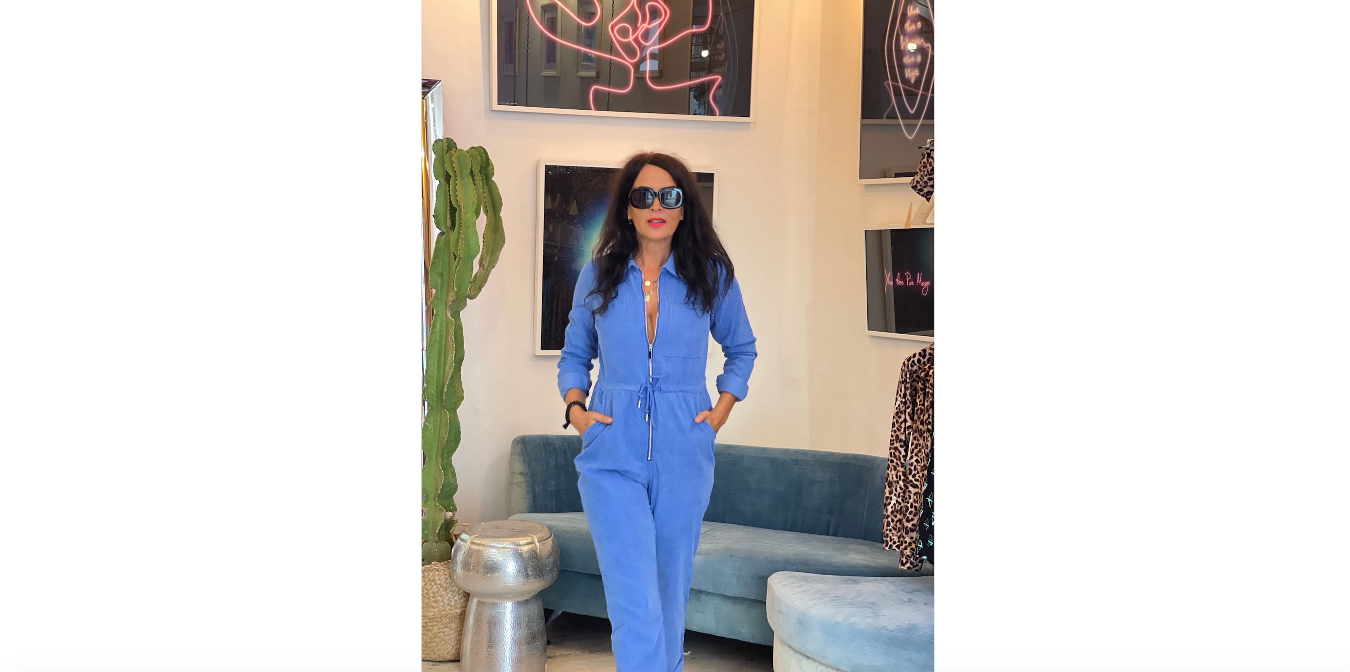 lady wearing blaze boiler suit in blue and sunglasses within dancing leopard store