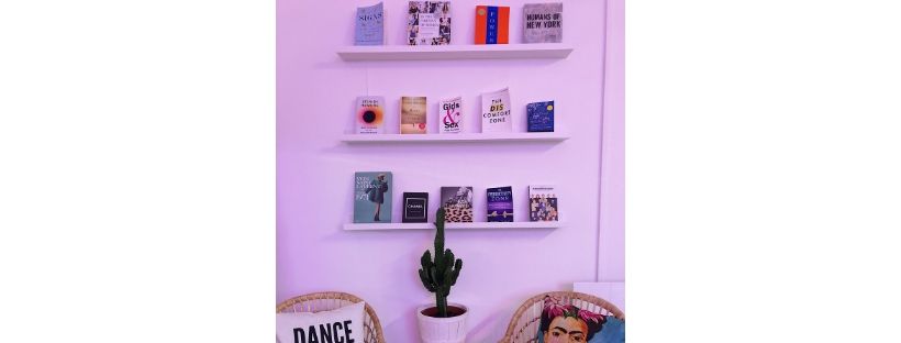 shelves with books on white wall