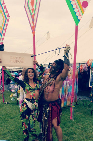 couple holding Dancing Leopard sign at Secret Garden Party