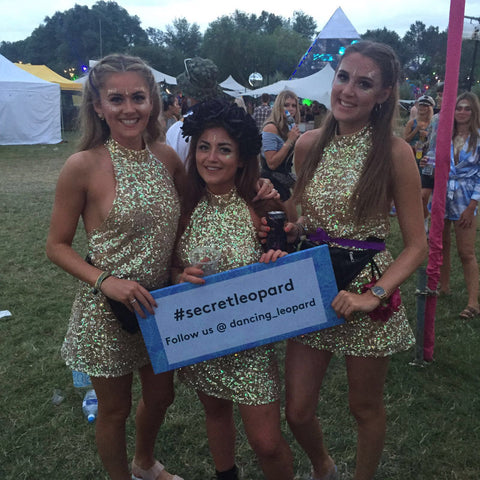 3 girls holding #secretleopard sign at Secret Garden Party 