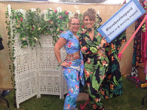 two girls holding #loveboxleopard sign at Lovebox