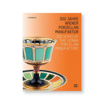 White and orange gradient book cover with porcelain goblet and dish featuring delicate ornamentation and swatches of many colors