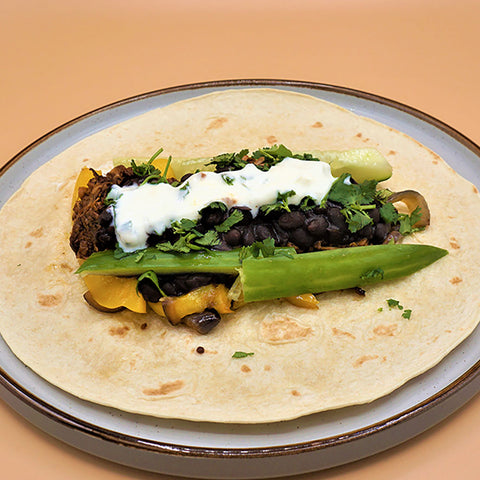 Seasonal veggie wrap with Jerk jackfruit, sweet yellow pepper & black beans