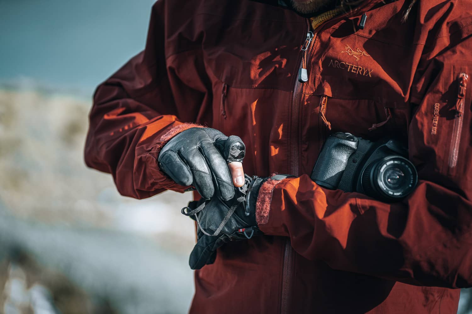 photographer wearing gloves with a pocket