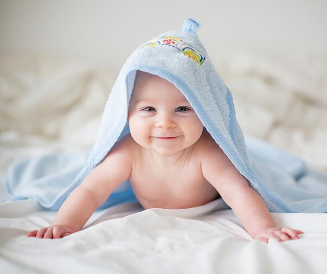 Happy Baby in Blue Blanket