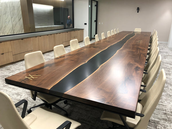 CS Woods black walnut inverted river table with black epoxy river and gold bar details